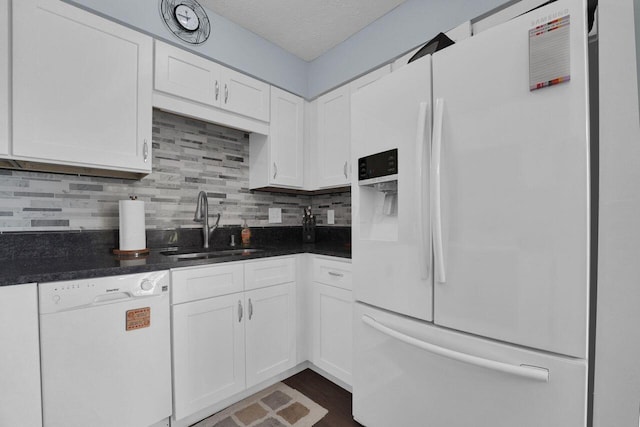 625 Country Club Dr Unit B14, Newark, OH 43055 - kitchen featuring dark countertops, a sink, white cabinetry, and white appliances