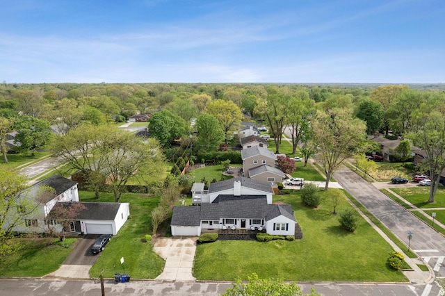 birds eye view of property with a residential view and a forest view