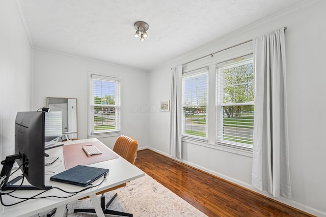 office with crown molding, dark wood-style flooring, and baseboards