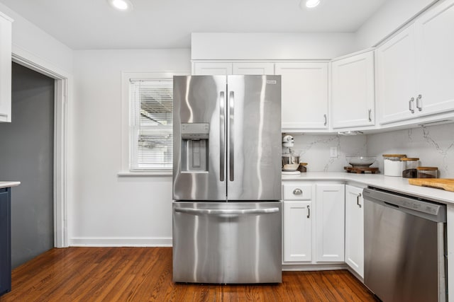 kitchen featuring light countertops, stainless steel appliances, white cabinets, and recessed lighting