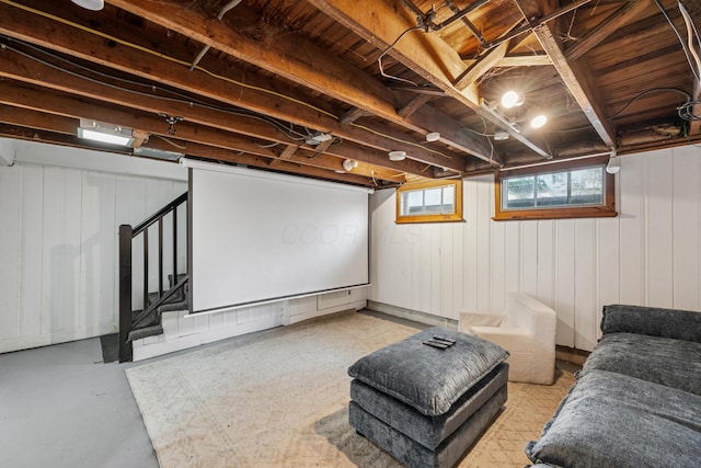 home theater featuring finished concrete floors