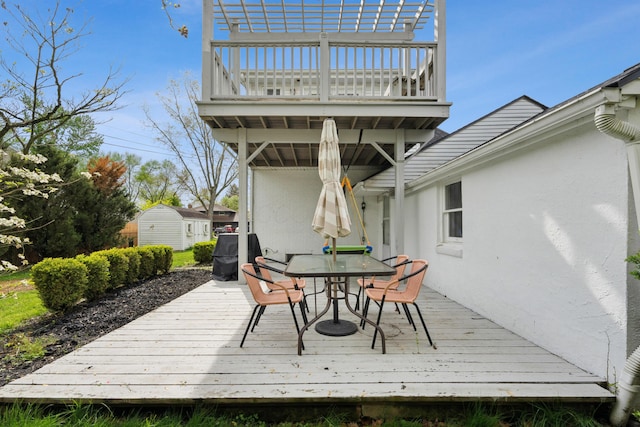 wooden deck featuring outdoor dining area