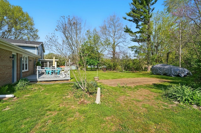 view of yard with a deck