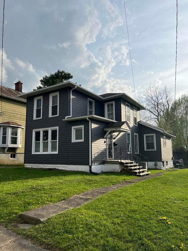 view of front facade featuring a front yard
