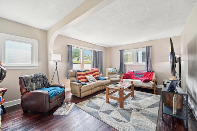 401 S 2nd St, Newark, OH 43055 - living area with plenty of natural light, a textured ceiling, baseboards, and wood finished floors