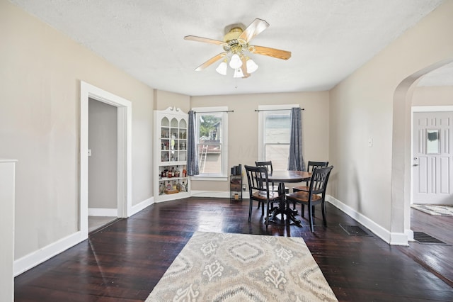 401 S 2nd St, Newark, OH 43055 - dining space featuring arched walkways, baseboards, wood-type flooring, and a ceiling fan