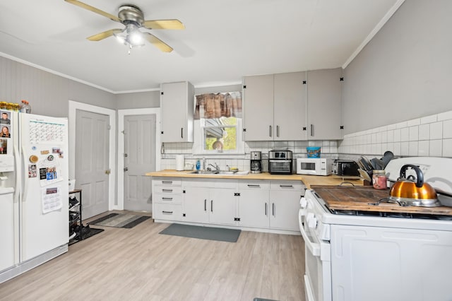 401 S 2nd St, Newark, OH 43055 - kitchen with a ceiling fan, backsplash, a sink, ornamental molding, and white appliances