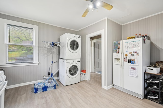 401 S 2nd St, Newark, OH 43055 - laundry area with stacked washing maching and dryer, crown molding, and light wood-style floors