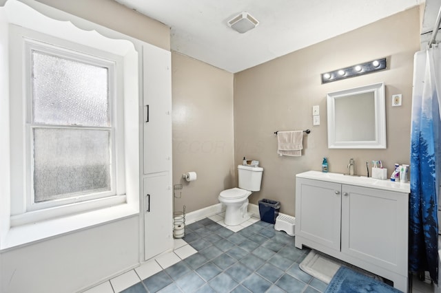 401 S 2nd St, Newark, OH 43055 - full bath featuring baseboards, tile patterned flooring, vanity, and toilet
