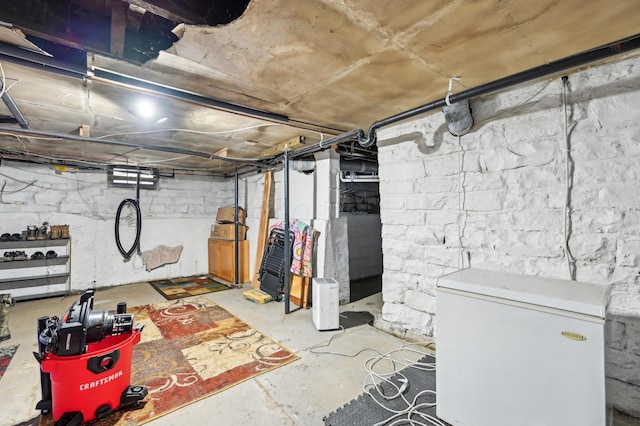 401 S 2nd St, Newark, OH 43055 - unfinished below grade area featuring white refrigerator