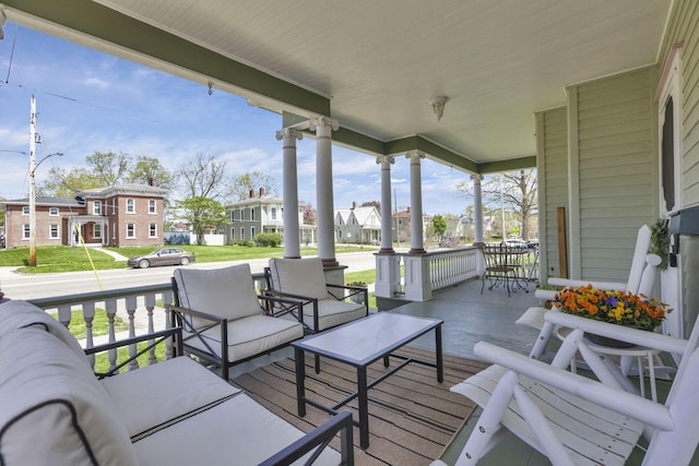 704 E High St, Mount Vernon, OH 43050 - wooden terrace with a residential view, an outdoor hangout area, and covered porch