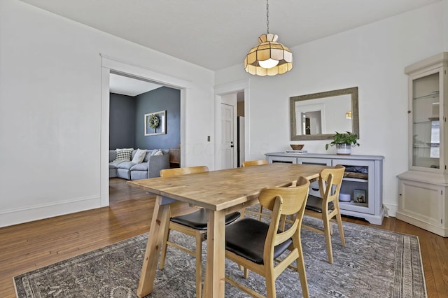 704 E High St, Mount Vernon, OH 43050 - dining room with baseboards and wood finished floors