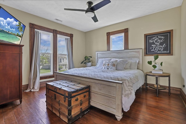 704 E High St, Mount Vernon, OH 43050 - bedroom featuring dark wood finished floors, visible vents, a ceiling fan, and baseboards