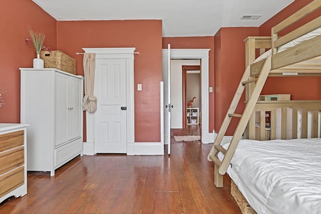 704 E High St, Mount Vernon, OH 43050 - bedroom featuring dark wood-type flooring, visible vents, and baseboards