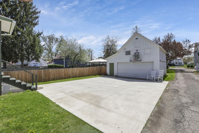 704 E High St, Mount Vernon, OH 43050 - exterior space featuring an outbuilding, a detached garage, fence, stairs, and a yard