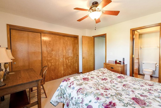 bedroom with carpet flooring, ensuite bath, a closet, and ceiling fan