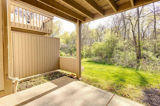 view of patio with a forest view