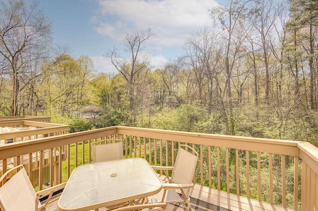 wooden deck featuring outdoor dining space