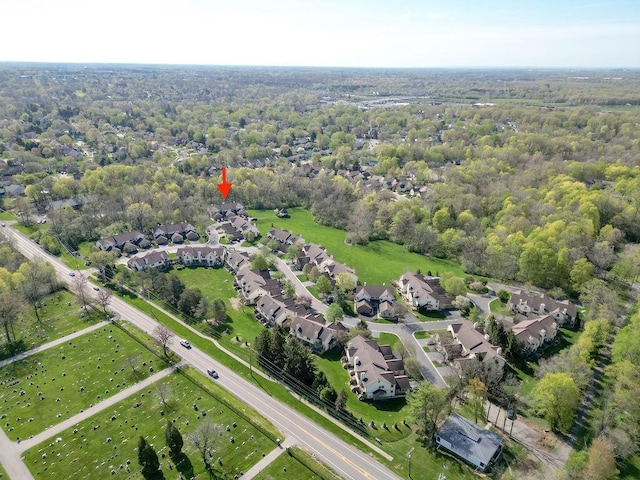 birds eye view of property with a residential view and a view of trees