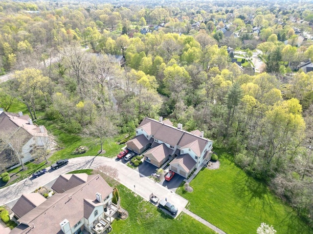 birds eye view of property featuring a view of trees and a residential view