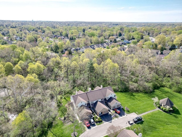 birds eye view of property with a wooded view