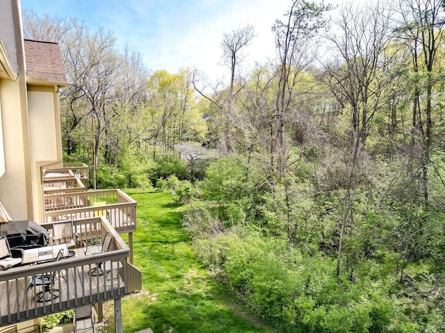 view of yard featuring stairway and a deck