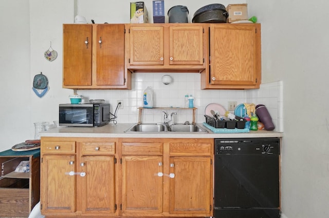 kitchen featuring a sink, light countertops, backsplash, and dishwasher