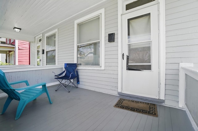 view of exterior entry featuring a porch