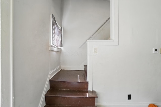 staircase with baseboards