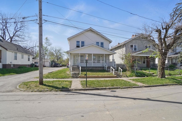 view of front of property featuring a porch and driveway