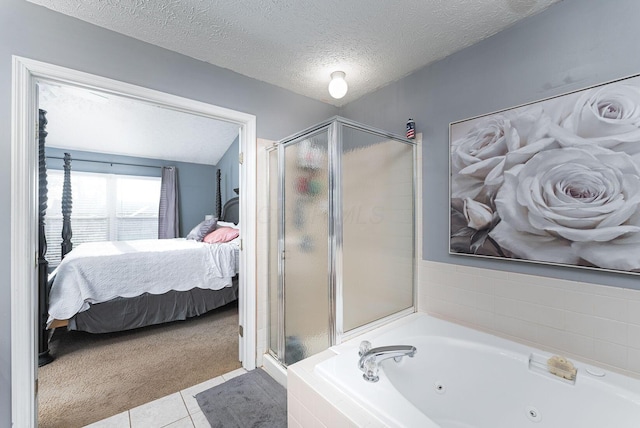 ensuite bathroom with a shower stall, tile patterned floors, a whirlpool tub, ensuite bath, and a textured ceiling