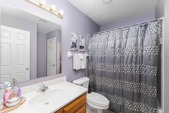 bathroom with a shower with curtain, a textured ceiling, toilet, visible vents, and vanity