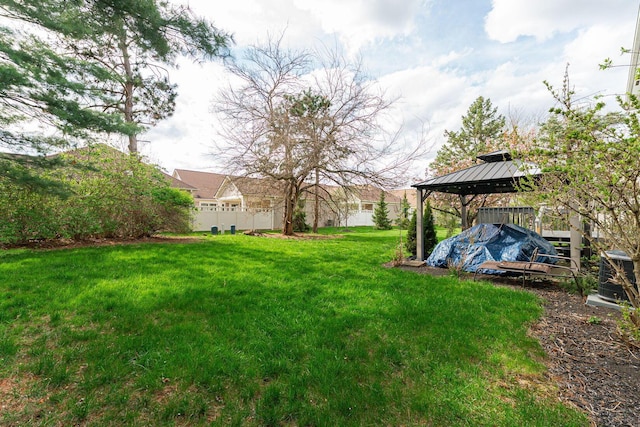 view of yard featuring a gazebo and fence