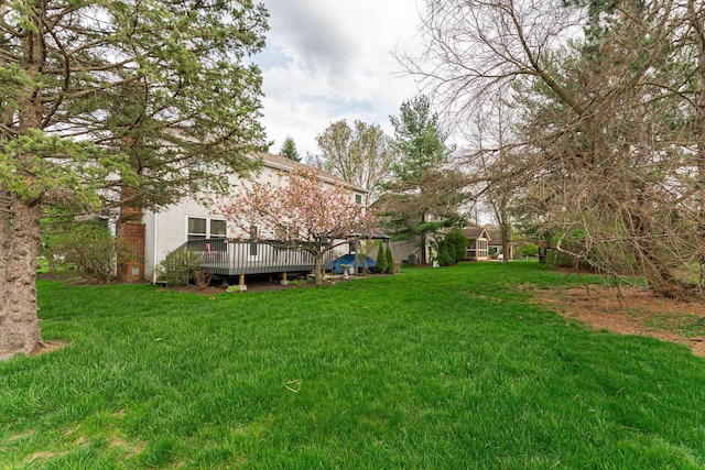 view of yard featuring a deck