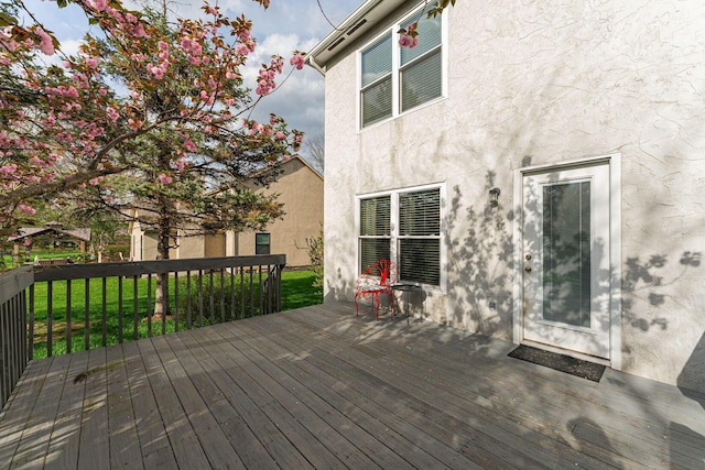 deck featuring a lawn