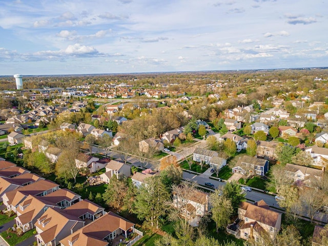 birds eye view of property with a residential view