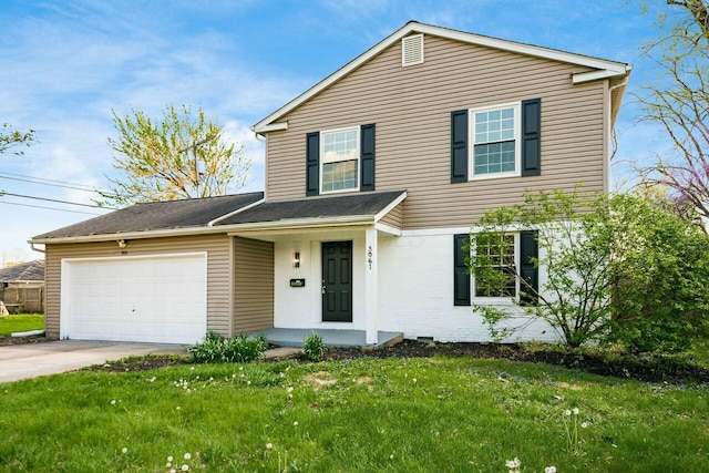 traditional-style home with a porch, concrete driveway, a front yard, and a garage
