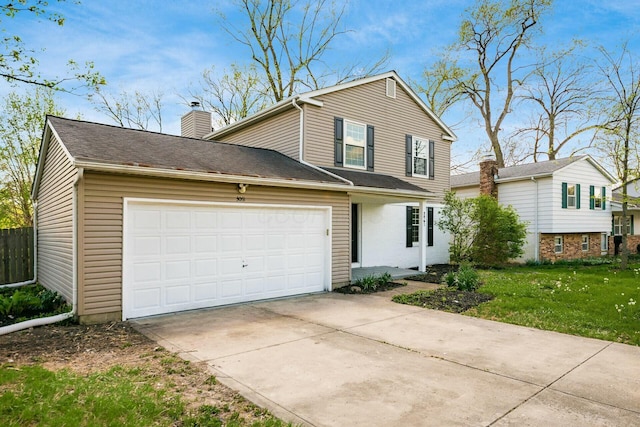 traditional-style home with a front lawn, driveway, a garage, and a chimney