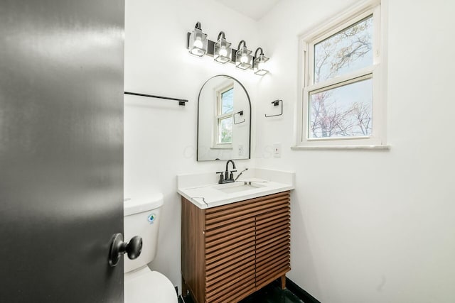 half bath with toilet and vanity