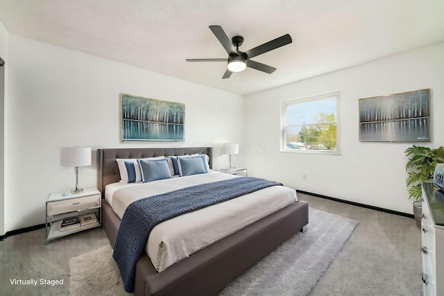 bedroom with baseboards, a ceiling fan, and carpet