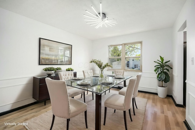 dining space with an inviting chandelier and light wood-style flooring