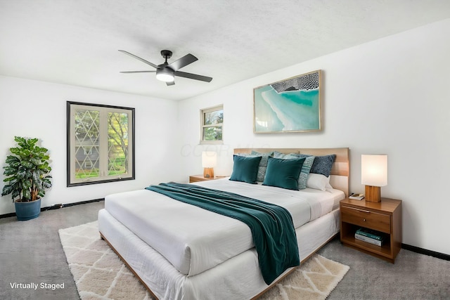 bedroom with carpet flooring, ceiling fan, and baseboards