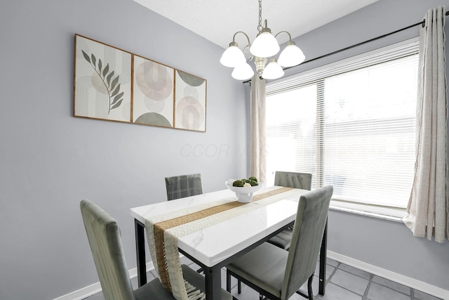 3236 Donalda Ct, Columbus, OH 43231 - dining space with a chandelier, baseboards, healthy amount of natural light, and tile patterned floors