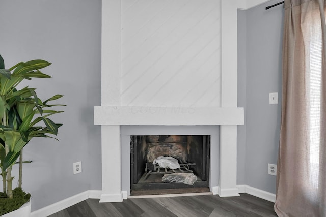 3236 Donalda Ct, Columbus, OH 43231 - detailed view of a fireplace, wood finished floors, and baseboards