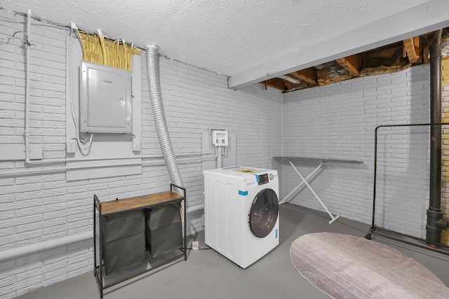 3236 Donalda Ct, Columbus, OH 43231 - washroom with washer / dryer, electric panel, brick wall, and a textured ceiling