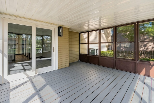 unfurnished sunroom featuring plenty of natural light
