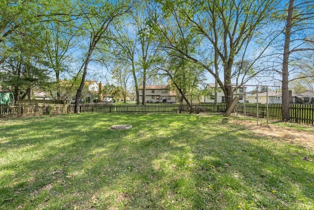 view of yard with a residential view and a fenced backyard