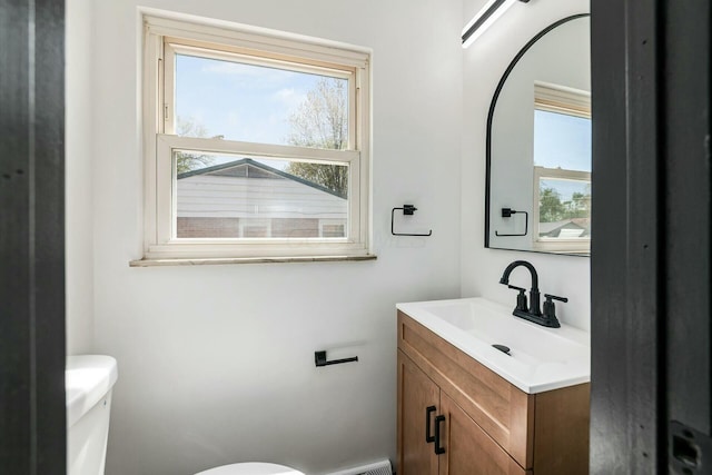 bathroom featuring vanity and toilet