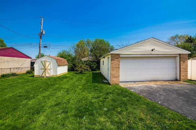 detached garage featuring fence