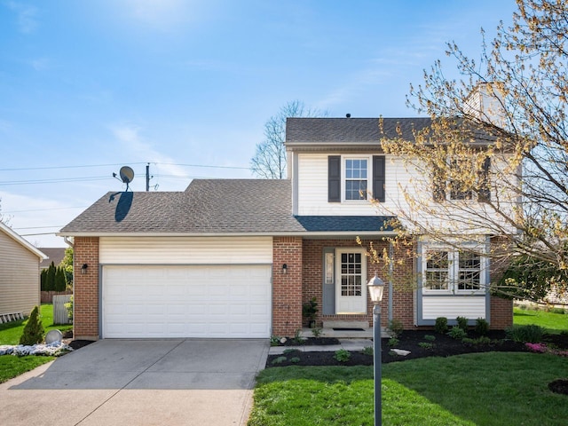 traditional-style home with an attached garage, driveway, brick siding, and a front yard